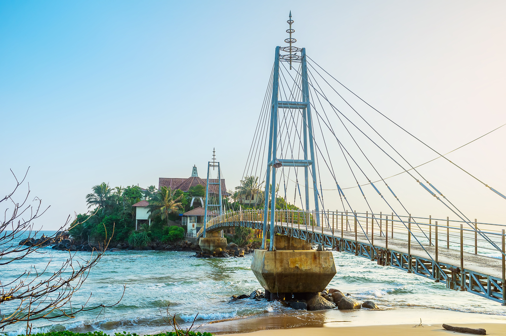 Cross the suspension bridge over the sea to check out the Paravi Duwa Temple in Matara.